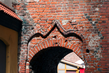 Riga Latvia, attractive rustic arch in red  brick wall