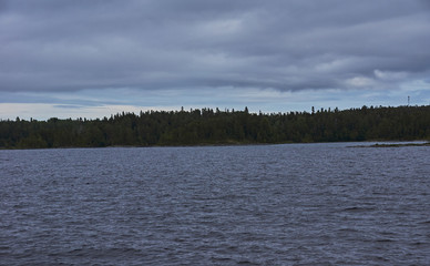 The nature of Karelia.Typical Karelian landscape on the island of Valaam: forest of conifers, Lake Ladoga, crag and volcanic rocks. Russia, Karelia