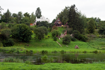 Fototapeta na wymiar Rural Latvia, village house by tranquil river