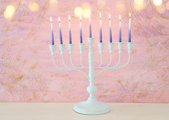 Religion image of jewish holiday Hanukkah background with menorah (traditional candelabra) and candles