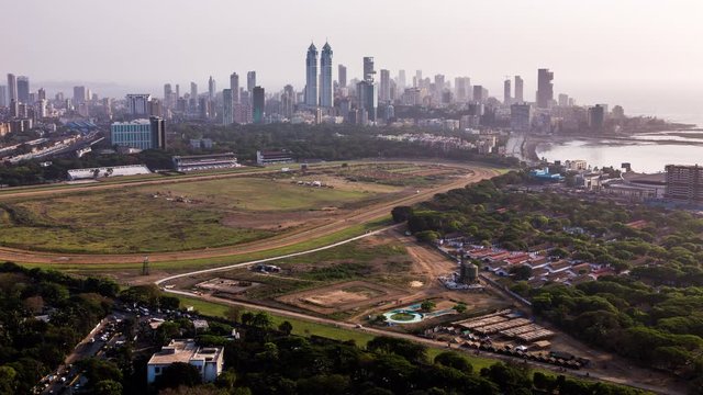 High angle view of Mahalakshmi Race Course Track in front of The Imperial towers and Tardeo business and financial district of Mumbai, India