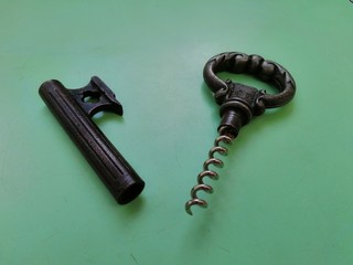 corkscrew with cork on white background