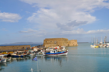 Fototapeta na wymiar Pier with yachts of the island of Crete in Aegean sea
