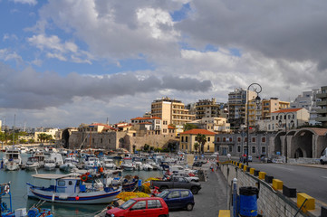 Fototapeta na wymiar Pier with yachts of the island Heraklion city of Crete in Aegean sea