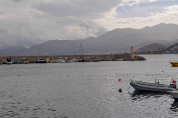 Fototapeta premium Pier with yachts of the island of Crete in Aegean sea