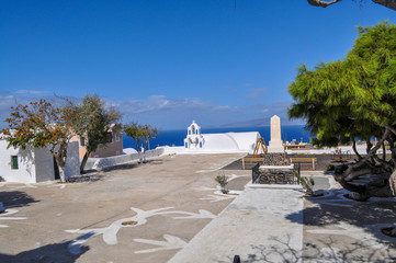 Monument and mini white church on the Santorini island