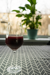 a glass of red wine in the home interior