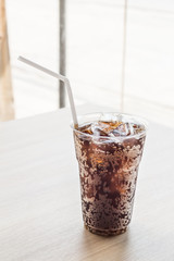Glass of fresh cola with ice