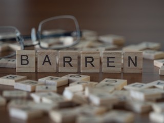 barren the word or concept represented by wooden letter tiles - obrazy, fototapety, plakaty
