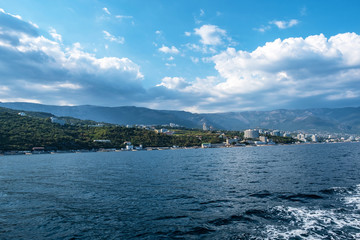 Fototapeta na wymiar View from the sea to the southern coast of Crimea in the Yalta region.
