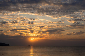 Beautiful sunrise with clouds on the southern coast of Crimea.