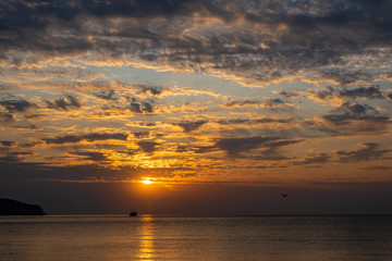 Beautiful sunrise with clouds on the southern coast of Crimea.