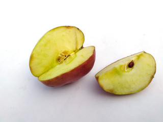 a fresh healthy red apple with a bite of apple isolated on white background