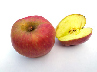a fresh healthy red apple with a bite of apple isolated on white background