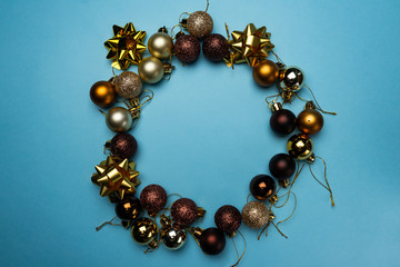 selective focus, Christmas tree toys on a blue background, copyspace