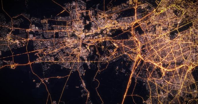 Aerial night view of city of Berlin, Germany. Traffic and street light glowing. Camera flying high above, moving around city from space filming cinematic straight down. 3d animation rendering.