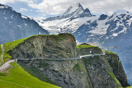 First Cliff Walk by mountains in Switzerland. Snowy mountains in the background