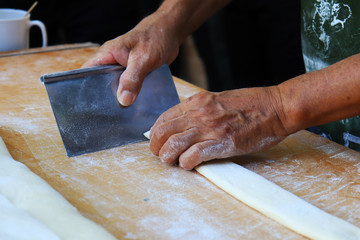 chef preparing dough in kitchen
