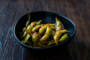 Spicy Sambal Edamame with Chopsticks / Spiced Style with Red Hot Chili Sauce.
