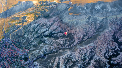 View of the air balloon flying over rock formation in Cappadocia, Turkey