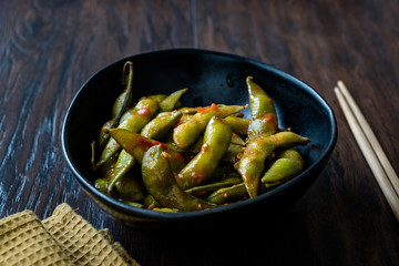 Spicy Sambal Edamame with Chopsticks / Spiced Style with Red Hot Chili Sauce.