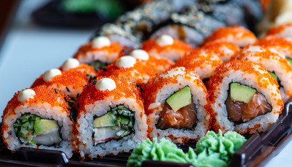sushi with salmon and green wasabi sauce. takeaway food
