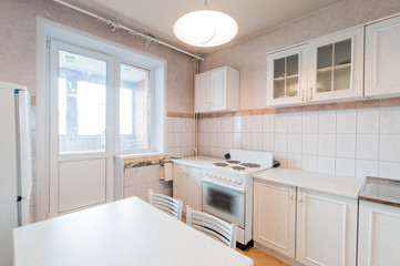 Russia, Moscow- July 23, 2019: interior room apartment. standard repair decoration in hostel. modern kitchen, dining area