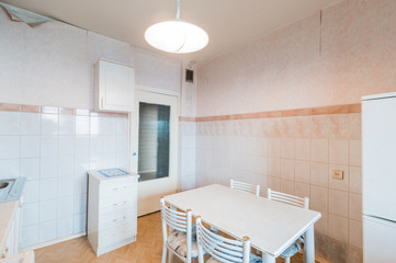Russia, Moscow- July 23, 2019: interior room apartment. standard repair decoration in hostel. modern kitchen, dining area