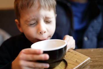Kid drinking tea
