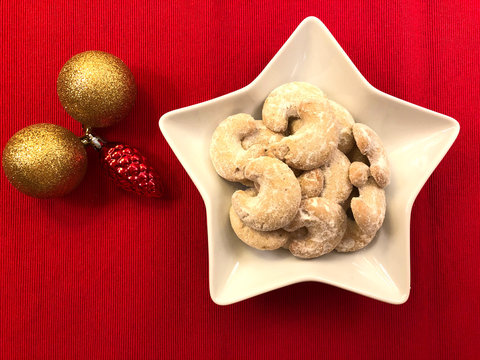 Traditional Austrian Christmas cookies "Vanillekipferl" Vanilla crescent cookies. Sugar coated biscuits in a "Kipferl" or horseshoe shape. Tea pastries and Christmas baking concept.