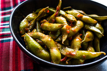 Spicy Sambal Edamame with Chopsticks / Spiced Style with Red Hot Chili Sauce.