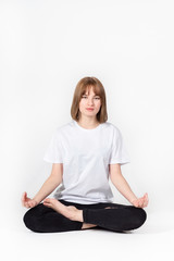 Girl meditating white background