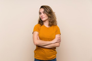 Obraz premium Young blonde girl over isolated background portrait
