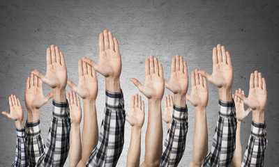 Row of man hands showing voting gesture