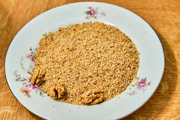 Grated walnuts on plate
