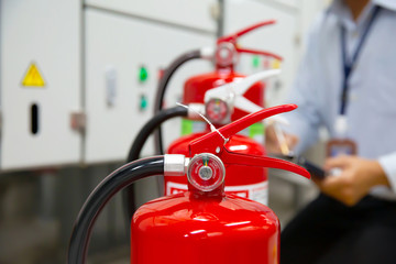 Engineer are inspection Fire extinguisher in fire control room for emergency, rescue and safety...