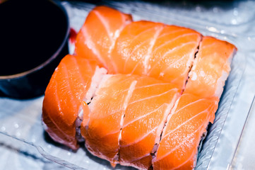 Delicious and fresh baked homemade rolls. Rice, fish, cucumber, cheese, nori. Asian food for the family.
