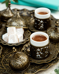 turkish coffee in ornated cup with lokums