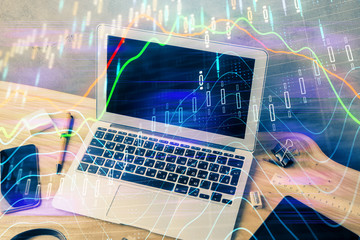 Multi exposure of chart and financial info and work space with computer background. Concept of international online trading.