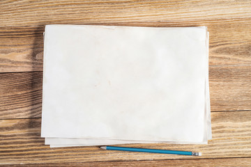 Sheet of paper lying on wooden table