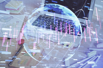 Financial graph colorful drawing and table with computer on background. Double exposure. Concept of international markets.