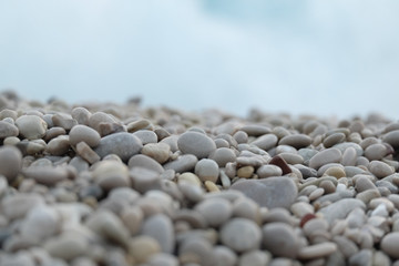 Sea ​​pebbles on the background of the coast. Belcekiz Beach. Oludeniz. Turkey  
