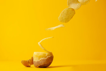 potato chips fly on a yellow background, the process of making chips, fast food levitation