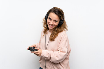 Young blonde woman playing at videogames