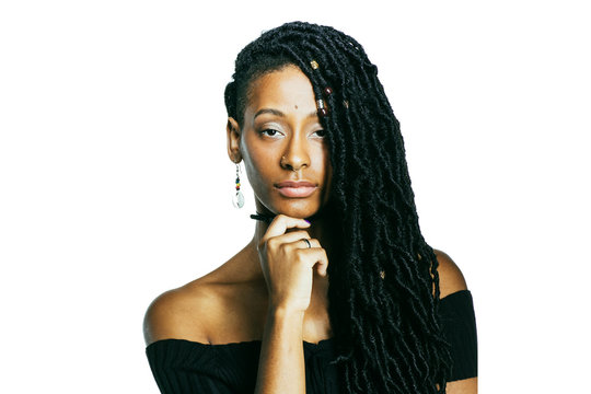 African American woman with dreadlocks looking at the camera thinking with hand on chin