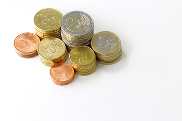 stack of european coins isolated on white background