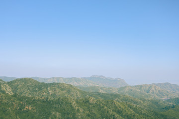 Fototapeta na wymiar Mountains forests sky blue landscape