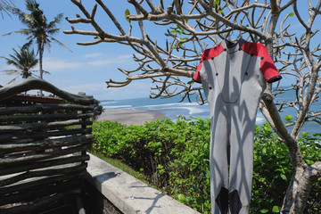 Wet Diving Suit Drying Out in the Sun. Bali island. Indonesia