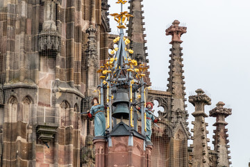 Naklejka premium Close-up of bells and other details from the Frauenkirche (woman church) in Nuremberg, Bavaria, Germany