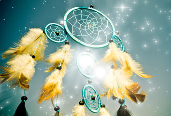 blue dreamcatcher with white feathers and stars  - obrazy, fototapety, plakaty